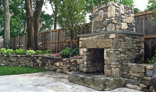 Fireplace with Granite Block, Raised Hearth and Blue Stone Mantle with Field Stone Retaining and Travertine Patio