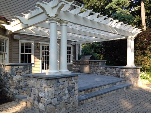 Raised Blue Stone Patio, Pergola with Stone Posts and Built in Grill by New View
