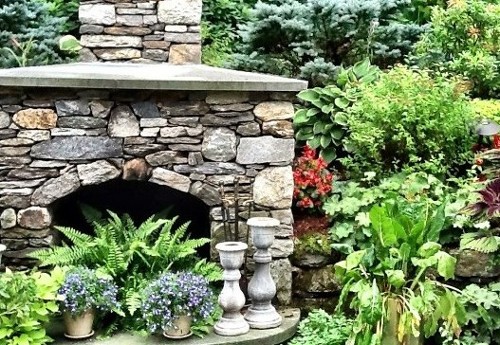 Fieldstone Fireplace and Landscape Planting by New View Inc.