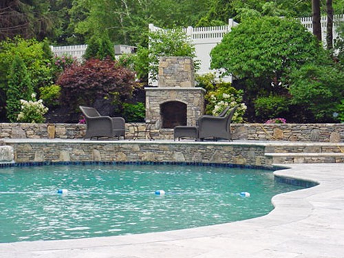 Free Form Pool, Fieldstone Elevated Patio& Fireplace with Travertine Deck by New View