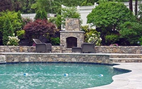 Raised Patio with Travertine Steps and Fireplace, Pool Design and Landscape by New View