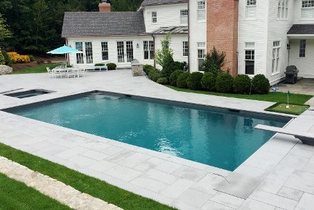 Blue Mist Granite pool deck, built-in spa and grill make this a back yard paradise