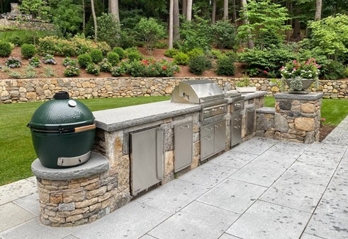 Stone bar with Big Green Egg smoker by New View