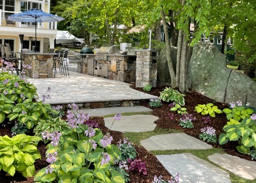 Natural stone walk to outdoor kitchen by New View