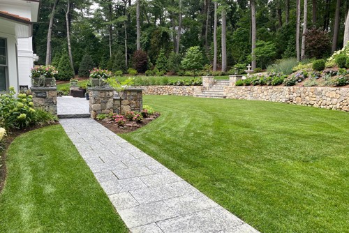 Granite walkway, posts, walls and landscape by New View